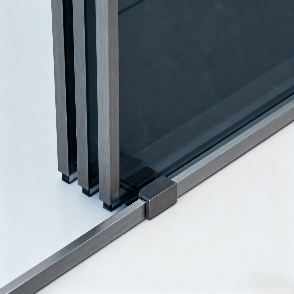 Three-panel sliding shower door